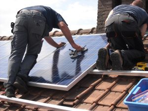 <img src="solar panels.jpg" alt="solar panels workers installing on the roof">